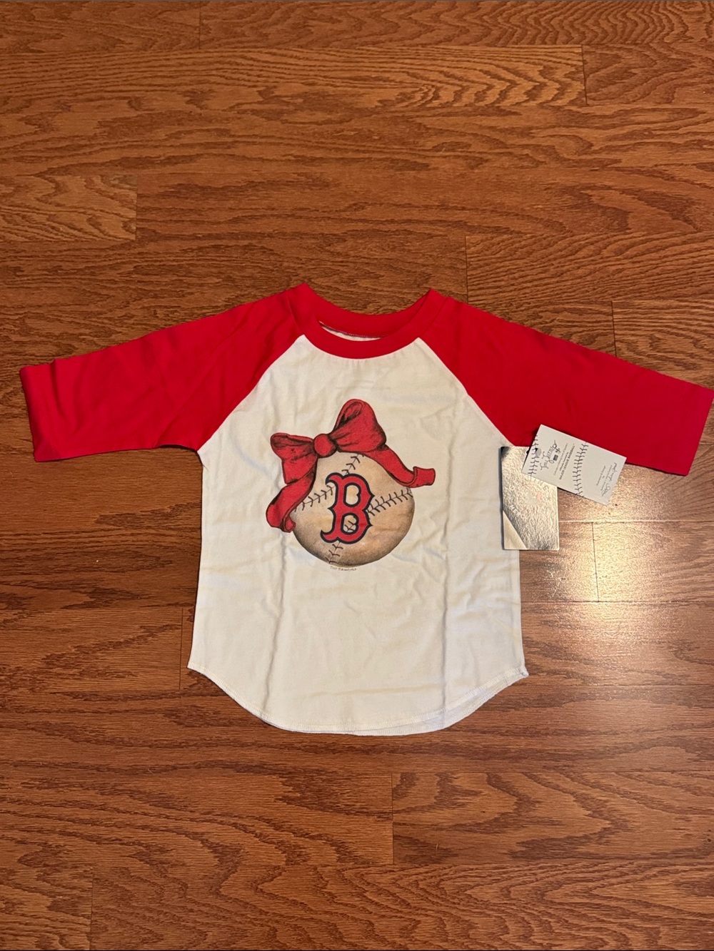 Genuine Merchandise Red & White Baseball Raglan Tee with Bow Graphic